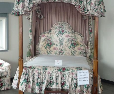<b>Winning bid:</b>  $2,250
<b>Presale estimate: $8,000 to $11,400</b>

Tally Wiener, 35, an attorney, spent more than $20,000, including $2,250 for the bed (mattress not included). Wiener said she worked on the liquidation of Fairfield Sentry Ltd., which invested with Madoff, and wanted to aid victims. “The king-size bed is bigger than my living room,” Wiener said, “I don't know what came over me.”  She noted she may reauction some of the stuff she bought to help investors of Fairfield Sentry. Wiener also plans to seek out Ruth Madoff and offer her the bed, “if she wants it.”

Bidders didn't seem to. The early 19th-century bed was a difficult sale. "Just $500?" the incredulous auctioneer, Bob Sheehan, said of the first bid. "This was the only bed in the whole house, I'm not kidding! $500? My God, it's not a pullout."

[Photo: Bloomberg News]

