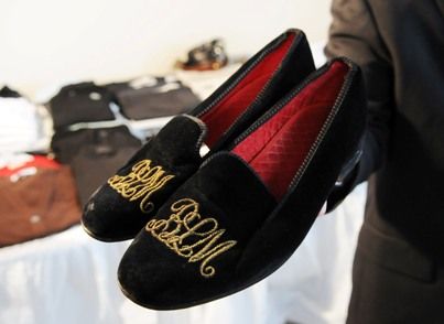 <b>Winning bid:</b>: $6,000

A man who declined to identify himself had his eye on this pair of black velveteen slippers, with the initials BLM embroidered in gold thread. He purchased a lot that included the slippers — valued at about $100 — along with Ruth Madoff's monogrammed shirt and other items. The man paid $6,000 for all of it. But he noted that he'll never be able to wear the slippers because his shoe size is 13; Madoff wore a size 8. 

[Photo: Bloomberg News]