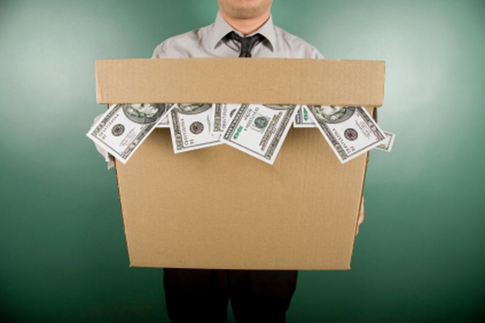 man holding box of money