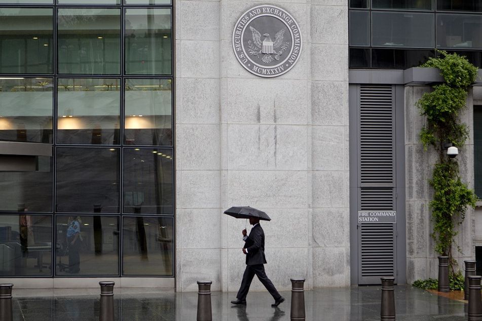 SEC building man umbrella