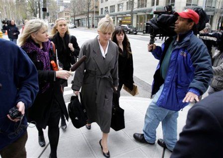 Kirkland investment adviser Rhonda Breard, center, refuses to answer questions as she leaves the federal courthouse in Seattle, Tuesday, April 6, 2010, after pleading guilty to stealing more than $9 million from her clients. <i>Photo: Associated Press</i>