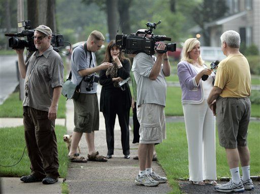 Neighbors are interviewed on Marquette Road in Montclair, N.J., on Monday, July 28, 2010. Their neighbors, "Richard Murphy" and "Cynthia Murphy" were arrested by the FBI at their house on Sunday. The Murphy's along with eight others are alleged to be secret agents spying for Russia. (AP Photo/Rich Schultz)