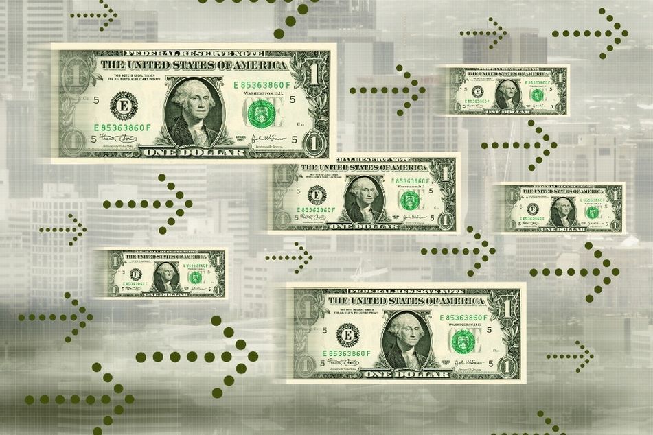 dollar bills moving with arrows