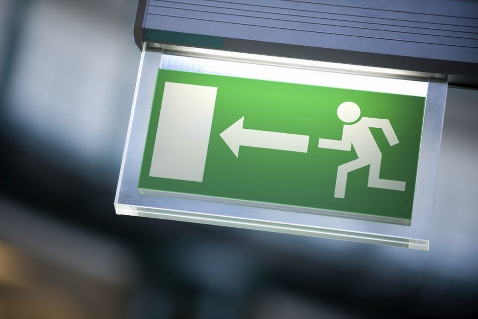 Green Exit sign with running figure