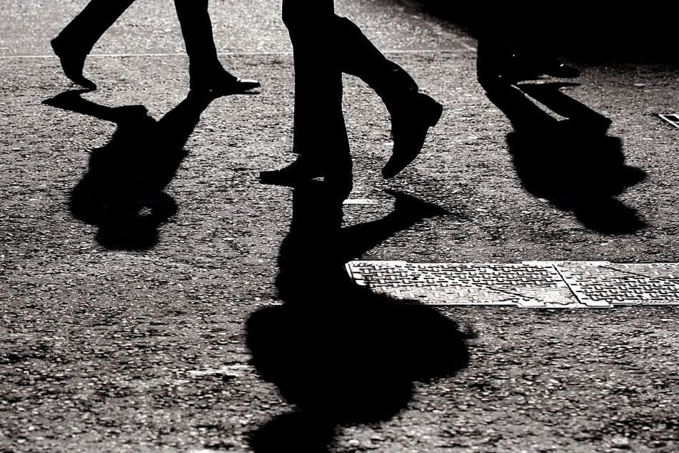 shadows people walking