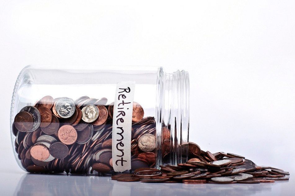 overturned jar labeled retirement money