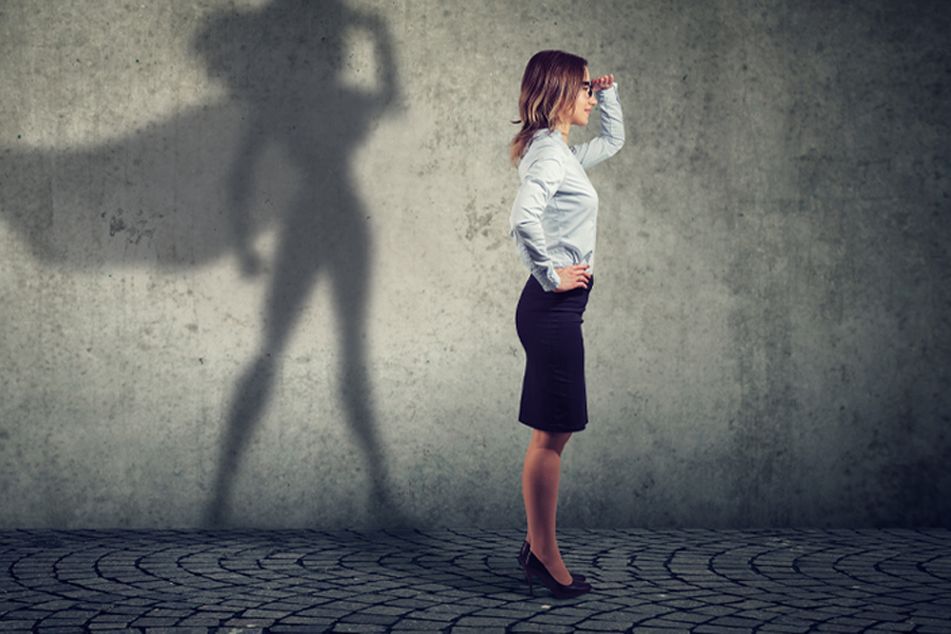 business women shadow with cape