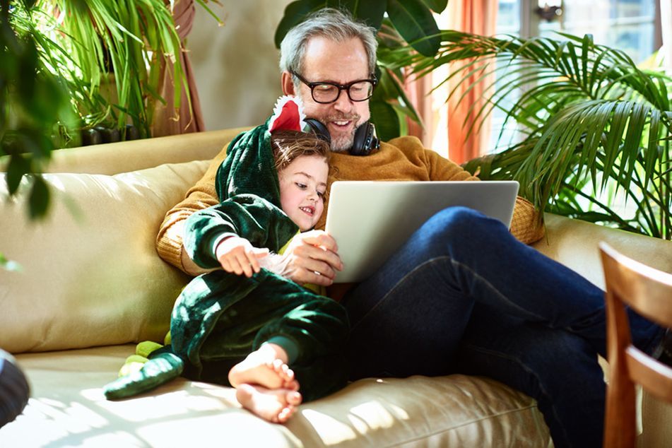 Older-father-with-toddler-on-couch