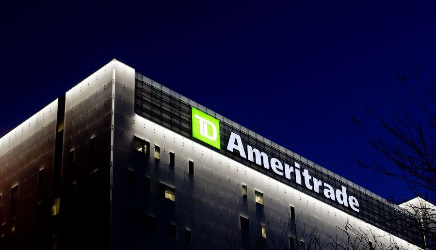TD Ameritrade Holding Corp. signage is illuminated atop the company's headquarters at night in Omaha, Nebraska, U.S., on Sunday, Oct. 23, 2016. TD Ameritrade and its largest stakeholder, Toronto-Dominion Bank, are close to a deal to buy online brokerage Scottrade Financial Services Inc. for $4 billion, according to people with knowledge of the matter. Photographer: Sarah Hoffman/Bloomberg
