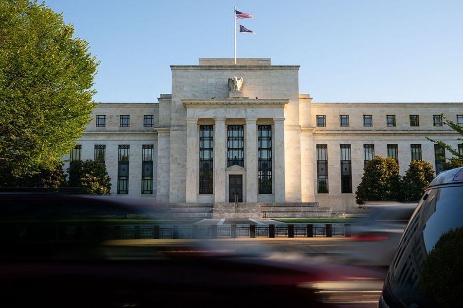 Federal-Reserve-headquarters-with-car-passing-by