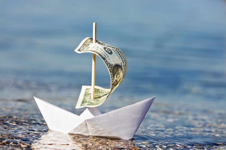 paper-boat-with-dollar-bill-as-sail