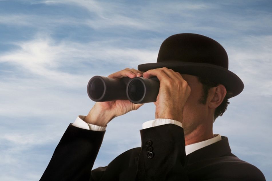 man-in-bowler-with-binoculars