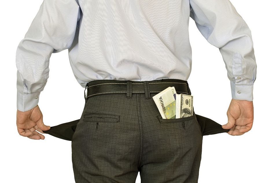 man-with-money-in-back-pocket-showing-side-pockets-are-empty