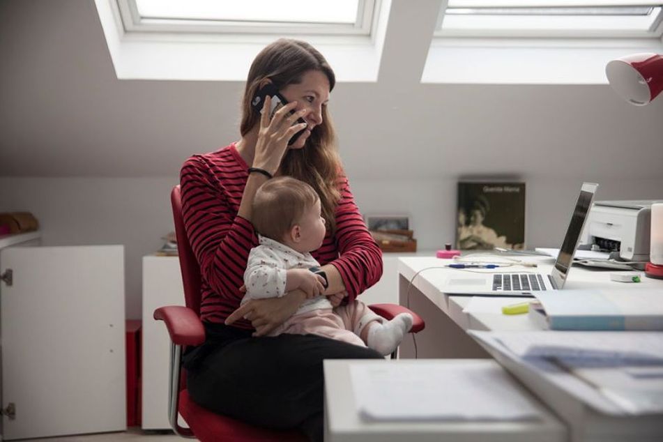 woman-at-laptop-with-baby