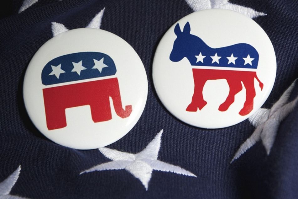 Republican and Democrati campaign buttons set on US flag