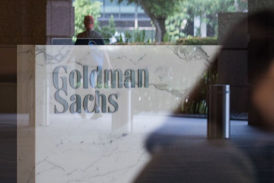 Goldman-Sachs-logo-on-window-with-trees-reflected