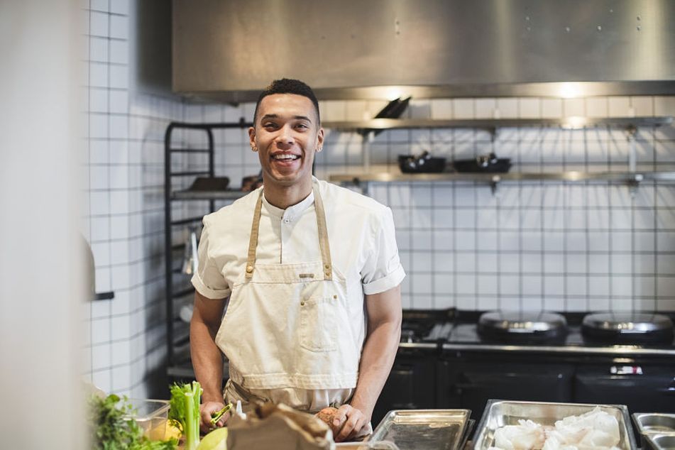 male-chef-in-kitchen-smiling
