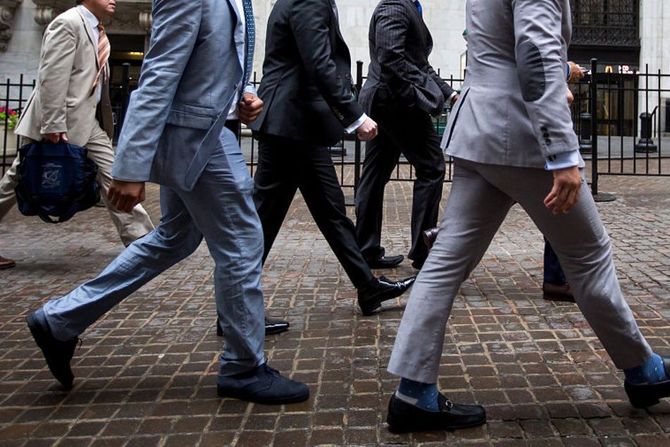 two-businessmen-walking-down-the-street