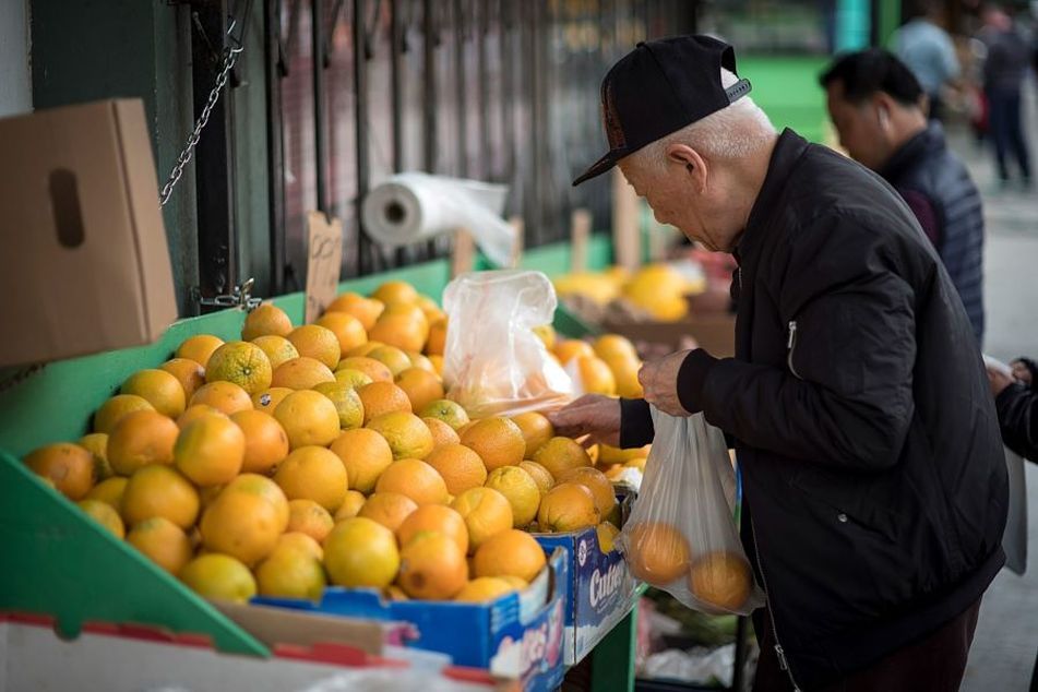 older-man-buying-oranges