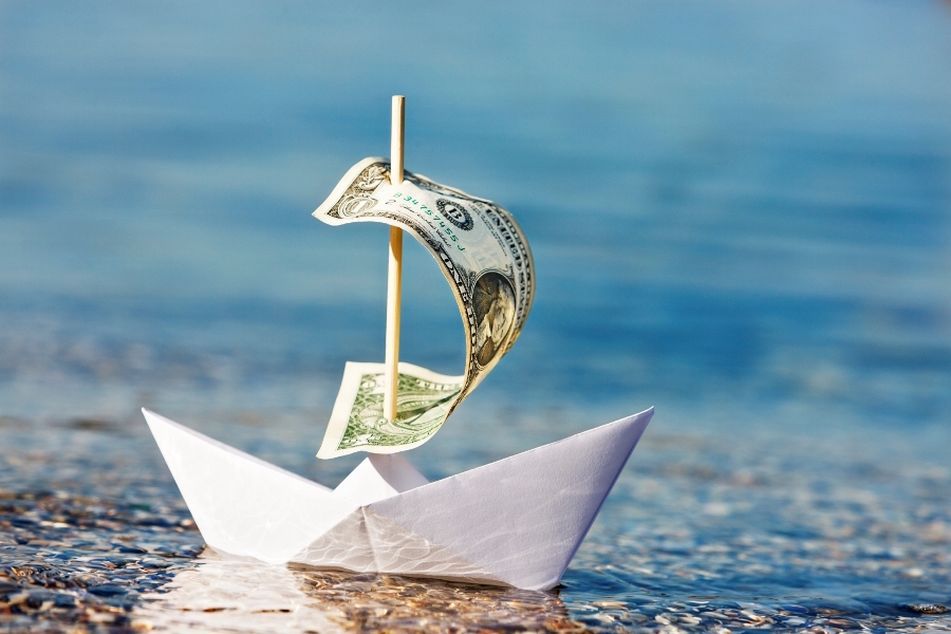 paper-boat-with-dollar-bill-for-sail