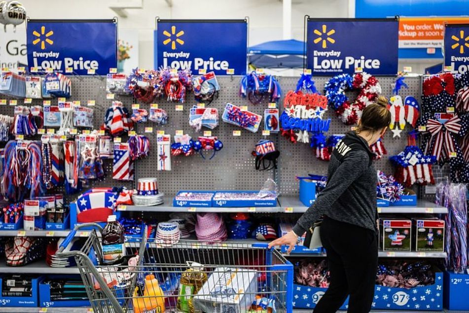 A customer views American flag themed decorations for sale at a Walmart Inc. store