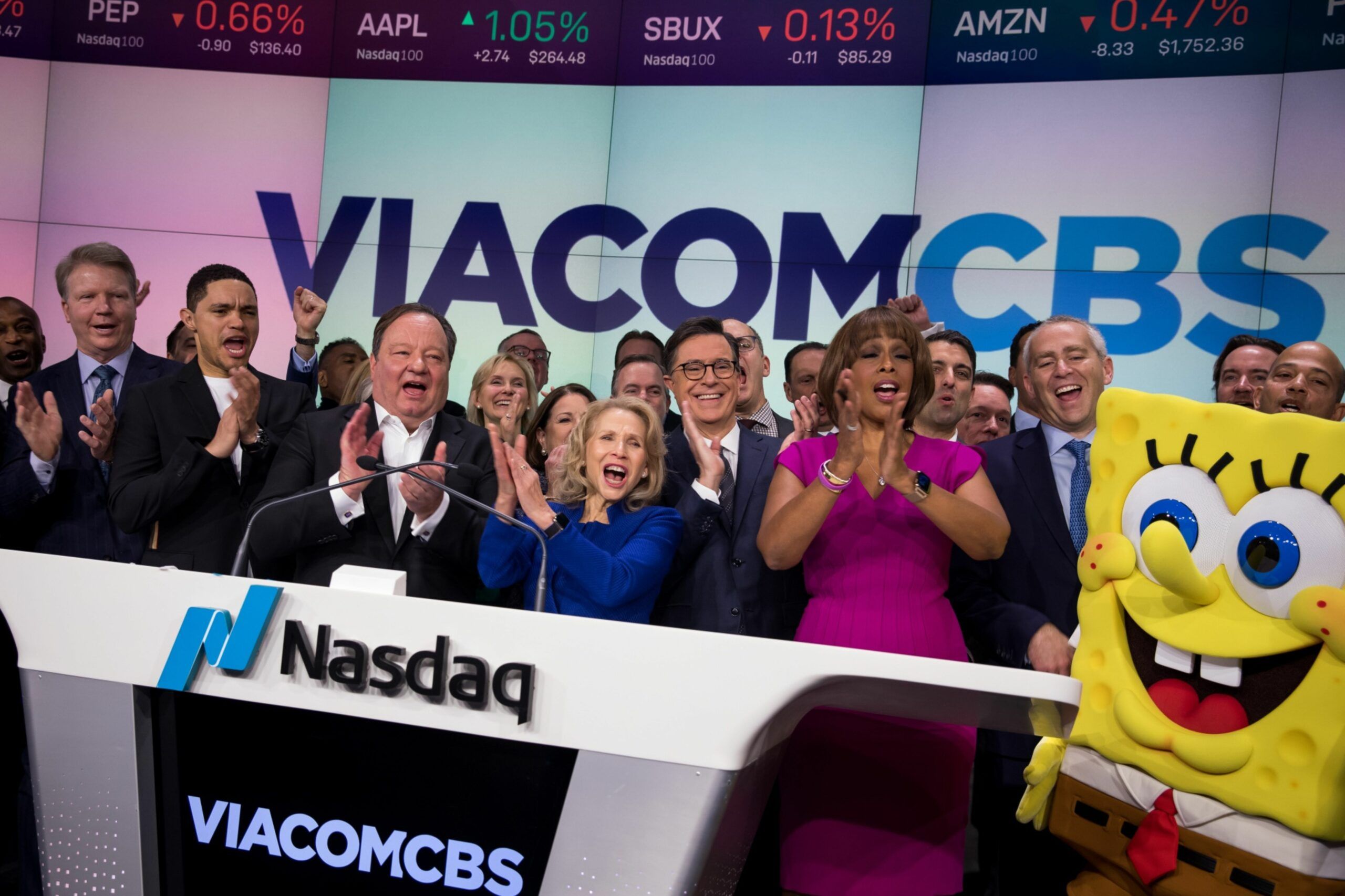 Bob Bakish, president and chief executive officer of ViacomCBS Inc., center left, and Shari Redstone, chair of VicaomCBS Inc., applaud during the opening bell in celebration of the company's merger at the Nasdaq MarketSite in New York, U.S. Viacom Inc. and CBS Corp. completed their merger on Wednesday, ending three years of on-and-off talks and creating what they boast is an entertainment colossus without peer. Photographer: Michael Nagle/Bloomberg