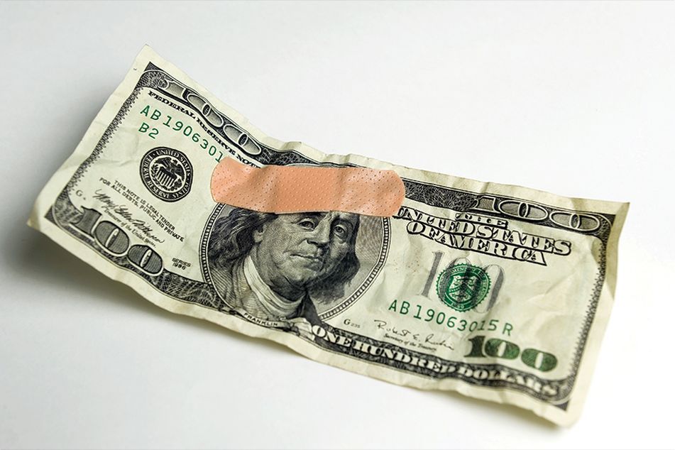 dollar with a bandaid