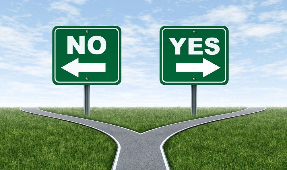 Yes or no decision symbol represented by a forked road with a road sign saying yes and another saying no with arrows for turning in the direction that is chosen after facing the difficult dilemma.