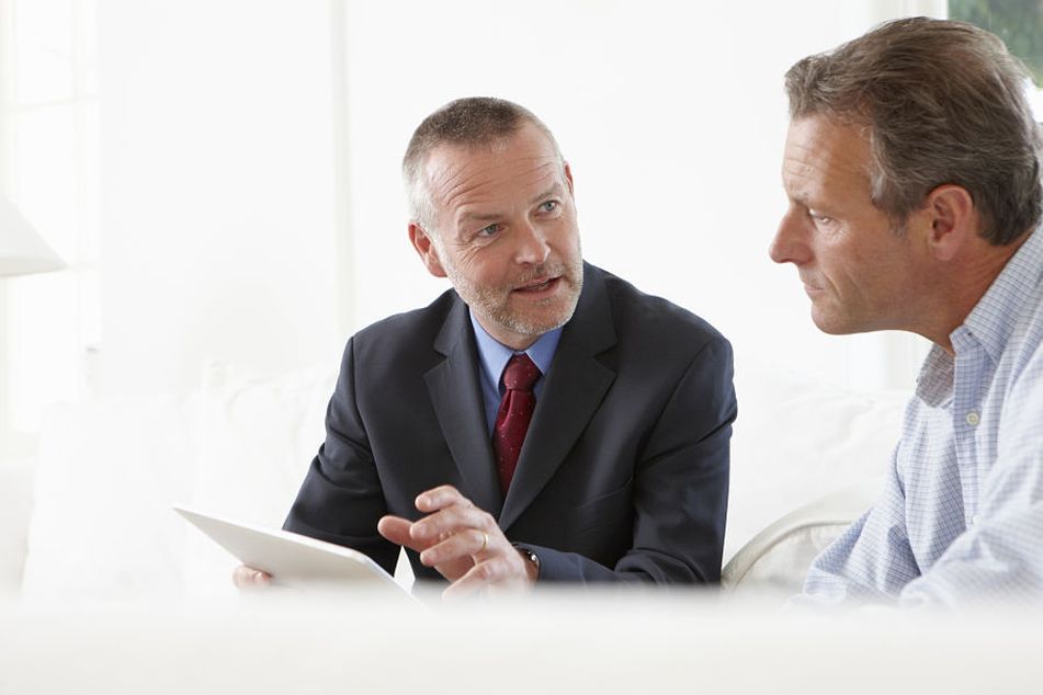 Financial adviser talking to male client