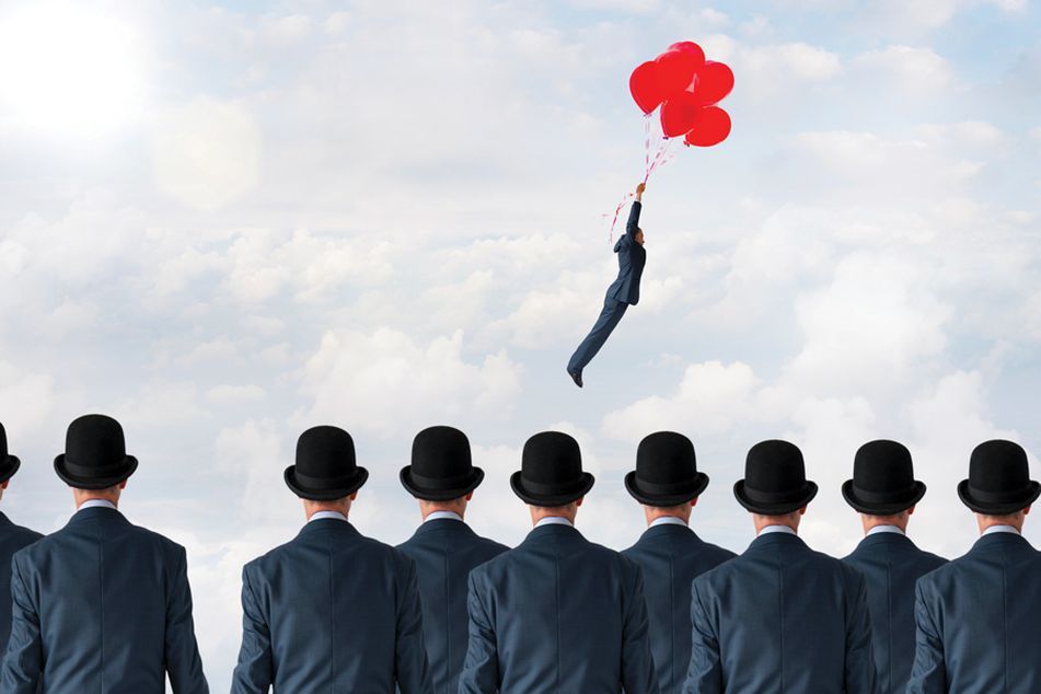 Businessmen in hats watch as businessman without a hat flies away with a parachute