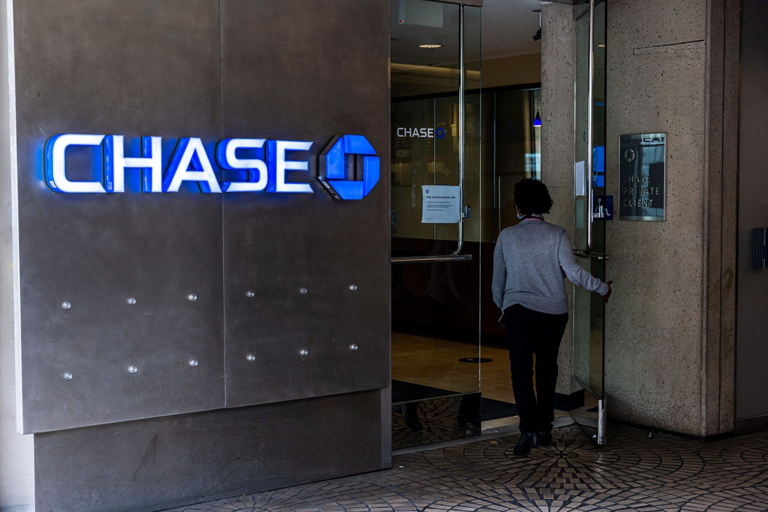 A customer enters a Chase bank branch in San Francisco, California, U.S., on Monday, July 12, 2021. JPMorgan Chase & Co. is expected to release earnings figures on July 13. Photographer: David Paul Morris/Bloomberg