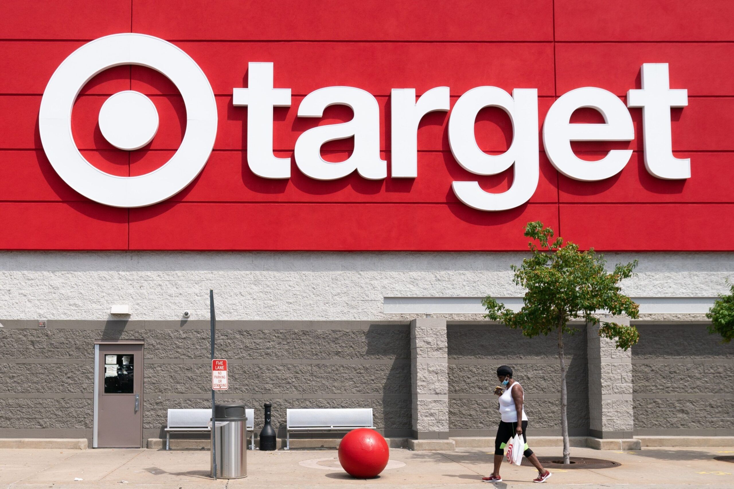 A shopper wearing a protective mask walks past a Target Corp. store in Jersey City, New Jersey, U.S., on Friday, Aug. 14, 2020. Target is scheduled to release earnings figures on August 19. Photographer: Jeenah Moon/Bloomberg