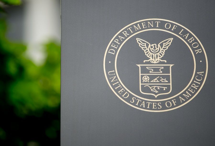 The U.S. Department of Labor seal is seen on a sign outside of the headquarters in Washington, D.C., U.S., on Wednesday, July 3, 2013. The U.S. Department of Labor is scheduled to release unemployment rate figures on Friday, July 5. Photographer: Andrew Harrer/Bloomberg