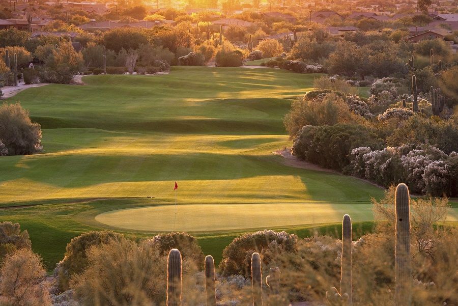 A beautiful desert golf course backlit. Phoenix, Arizona. Golf in the Scottsdale, Phoenix, and Mesa region - which some people refer to as The Valley of the Sun - is one of the world's great golf destinations. There are, literally, a couple of hundred courses in this area. Many feature beautiful contouring and shaping and are routed through rugged desert terrain with cacti and beautiful natural surroundings.