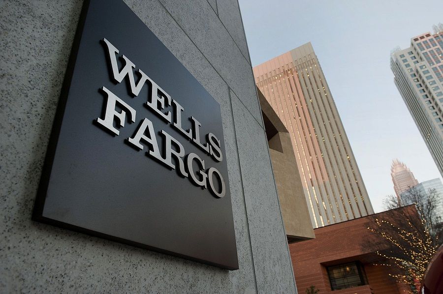 Wells Fargo & Co. signage is displayed outside of the Duke Energy Center building in Charlotte, North Carolina, U.S., on Thursday, Dec. 13, 2012. The new Wells Fargo & Co. expanded trading floor, which opened on Dec. 10, is located in the Duke Energy Center. Photographer: Davis Turner/Bloomberg