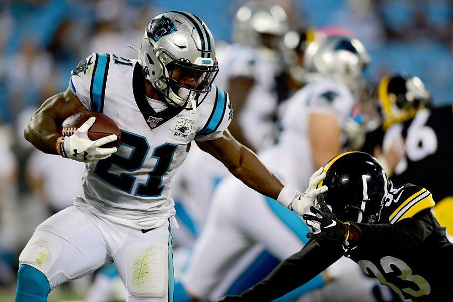 CHARLOTTE, NORTH CAROLINA - AUGUST 29: Elijah Holyfield #22 of the Carolina Panthers tries to escape Trey Edmunds #33 of the Pittsburgh Steelers during their preseason game at Bank of America Stadium on August 29, 2019 in Charlotte, North Carolina. (Photo by Jacob Kupferman/Getty Images)