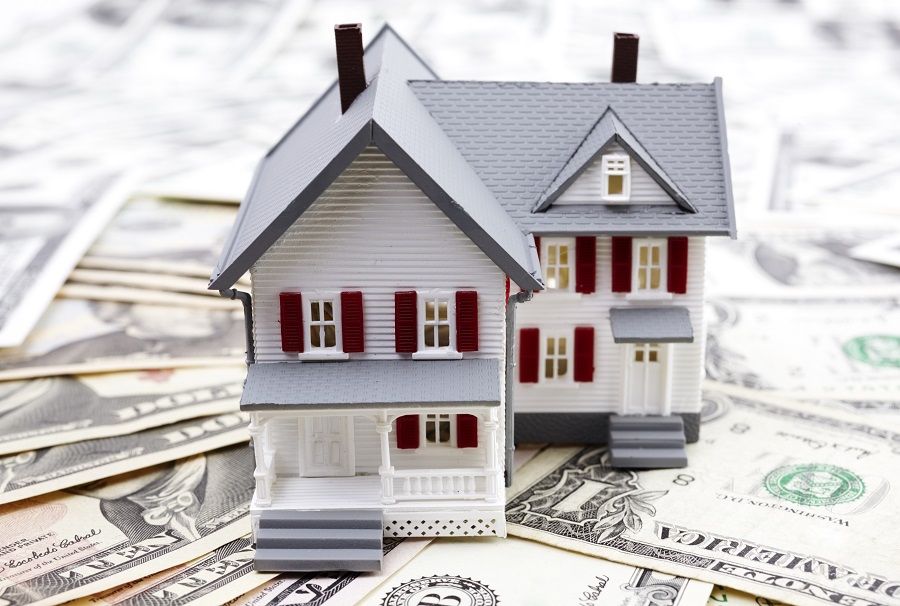 model of the house and us dollars , selective focus, finance or rental concept