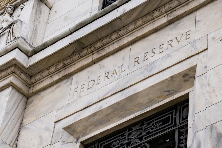 Fed officials see price pressures easing, but still cautious on rate cuts